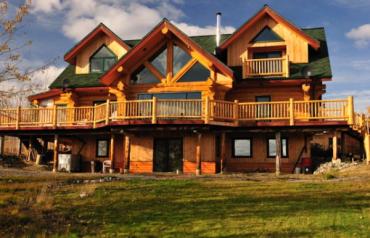 Three levels open concept with high ceilings log home surrounded by wilderness